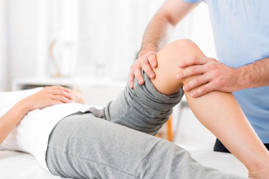 Physiotherapist treating a patient